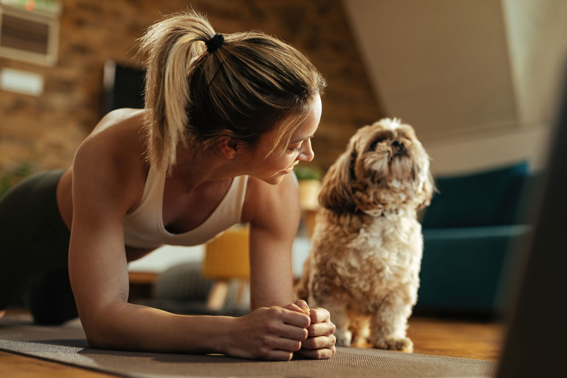 Girl Exercising with Dog